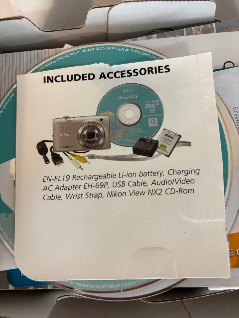 Nikon Coolpix S3100 camera with charger box and everything shown
